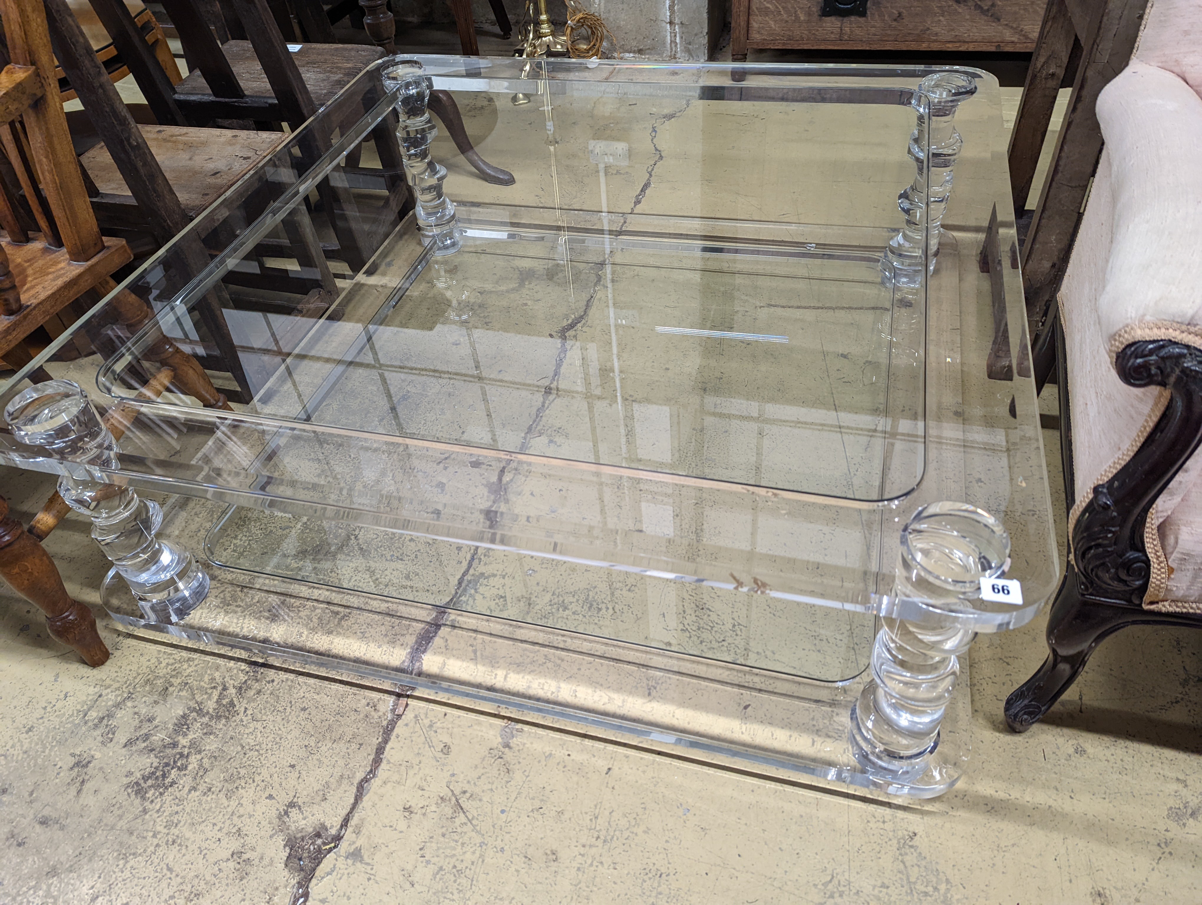 A contemporary perspex and glass square two tier coffee table, width 120cm, height 40cm